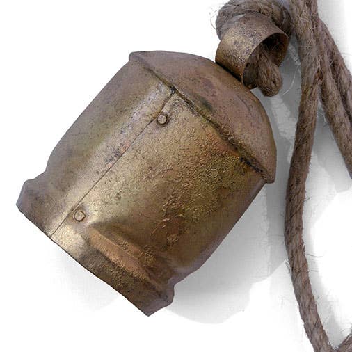 Rustic metal bell with a rope on a white background